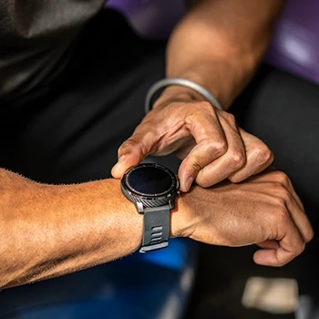 A man wearing a fitness tracker watch with good display and strap size
